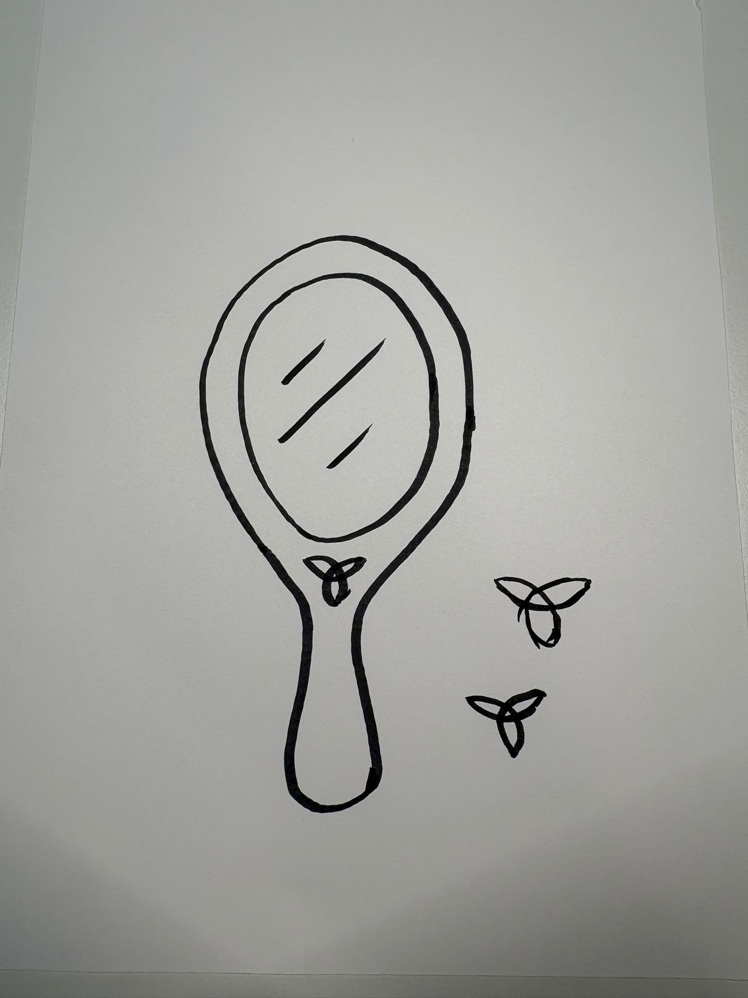 A hand mirror drawn in ink with a brush pen, close to the final version